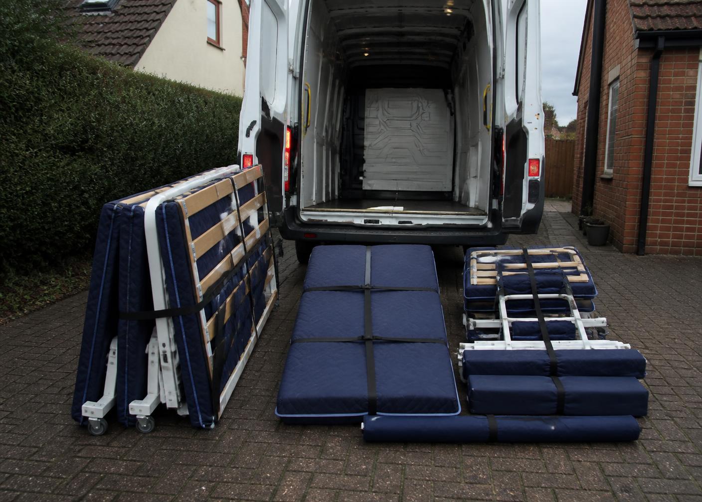 Dismantled profiling bed components protected and strapped ready for transport